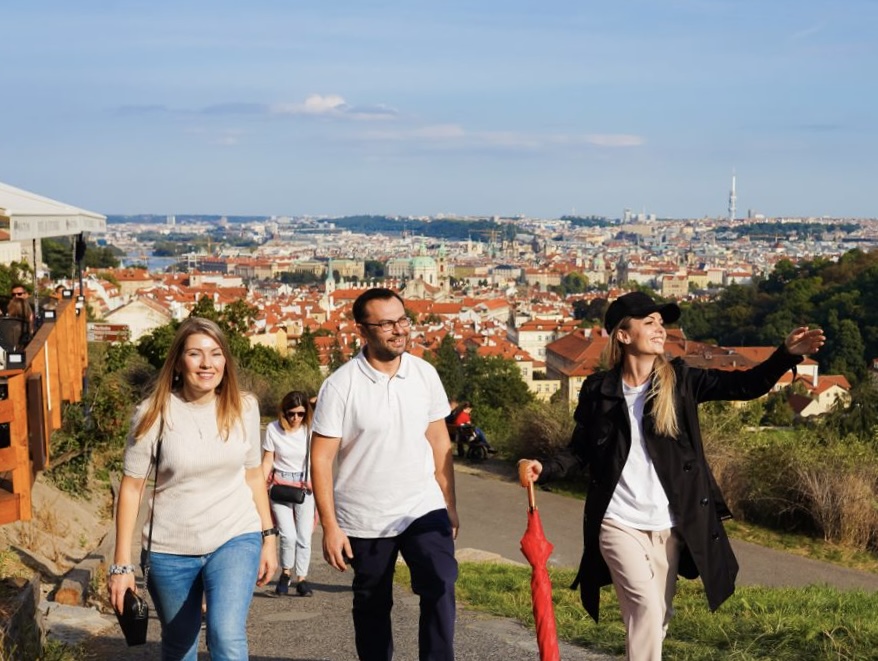 Prague panoramic view with Charles Bridge and red umbrella